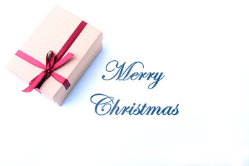 Text merry christmas on paper with gift box