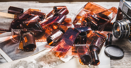 Old photo film rolls, cassette and retro camera. Vintage stylized.