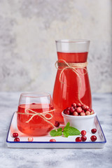 Healthy cranberry juice drink and fresh cranberries. Traditional Russian beverage mors © natkinzu