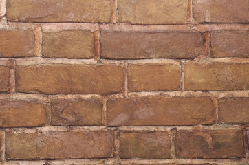 Obraz premium The background of the old brick wall, tinted in light brown