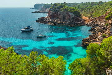 Majorca beautiful seascape bay with luxury yachts at the coast of Calo des Moro, Mallorca Mediterranean Sea, Balearic Islands