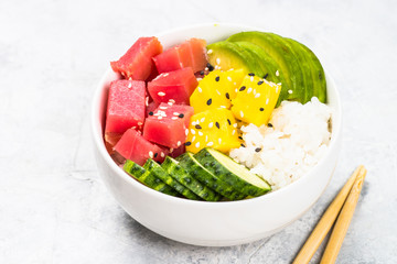 Tuna poke bowl with rice and vegetables.