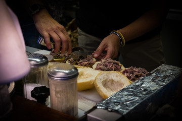 The preparation of sandwiches with lambredotto, a typical Tuscan street food. It is a boiled tripe...
