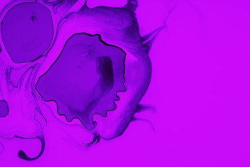 Color paint drops in water. Ink swirling underwater.