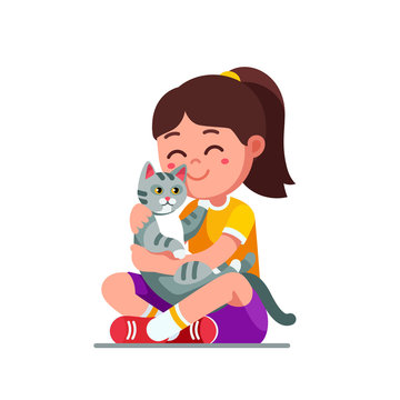Happy preschool girl kid embracing and patting cat