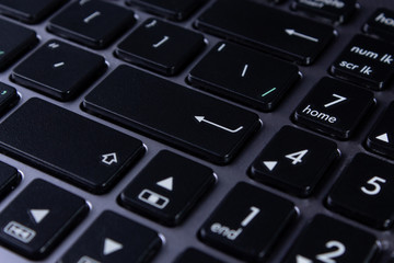 Black laptop keys close up, part of a PC