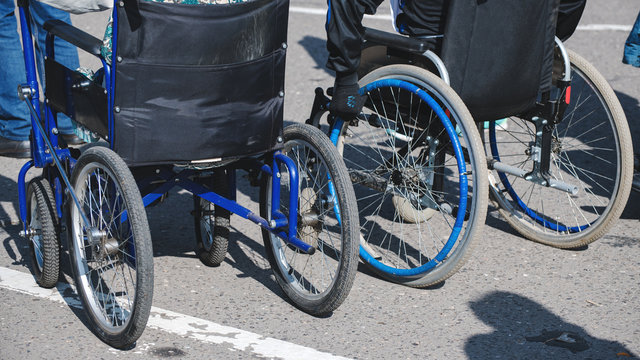 wheelchair wheels closeup on asphalt