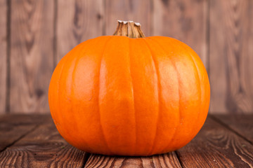 Fresh pumpkin on a wooden background (view from a different perspective in the portfolio)