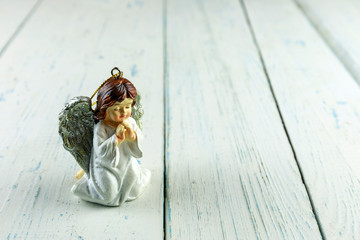 Christmas ceramic angel figurine or statuette isolated on white