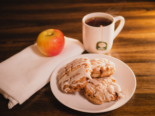gourmet morning breakfast with scones, apple, and a cup of tea