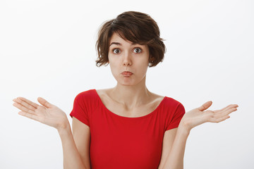 Oops bummer not big deal. perplexed careless relaxed cute awkward attractive woman short haircut...