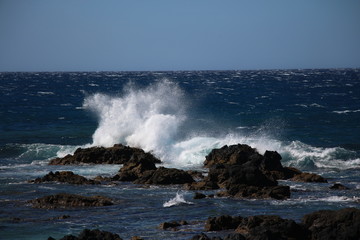 waves crashing on rocks