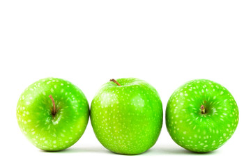 GREEN APPLES ON WHITE BACKGROUND. HEALTHY FOOD