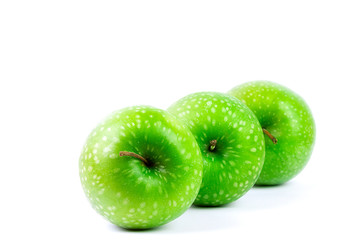 GREEN APPLES ON WHITE BACKGROUND. HEALTHY FOOD