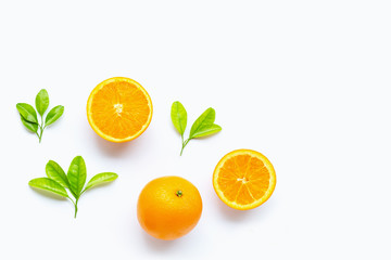 Fresh orange citrus fruit with leaves isolated on white background.