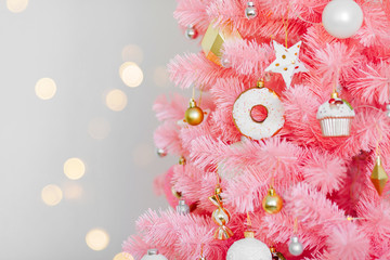 Pink Christmas tree and christmas decorations white and gold color.  Christmas background. Happy New Year and Xmas Christmas concept. .