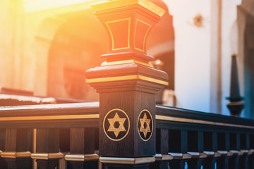 Star of David, Jewish symbol on wood in synagogue in sunlight