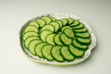 Cucumber plate on a white background