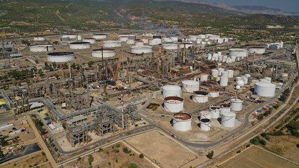 Fototapeta premium Aerial drone photo of famous full working plant and oil refinery in Corinth area, Greece