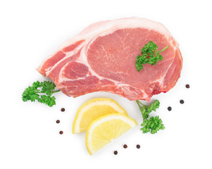 sliced raw pork meat with parsley and lemon isolated on white background. Top view. Flat lay