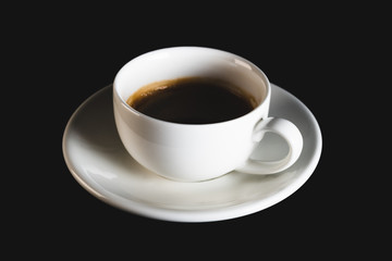 White espresso cup with black coffee on black background. Coffee cup rear view