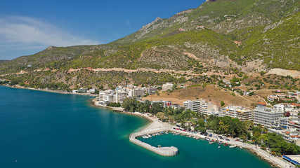 Aerial drone photo of famous seaside area and main town of Loutraki with sandy organised beach with...