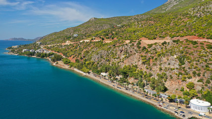 Aerial drone photo of famous seaside area and main town of Loutraki with sandy organised beach with...