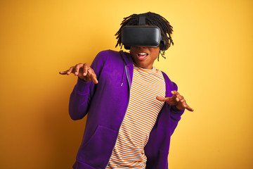 Young african american man playing virtual reality game using goggles