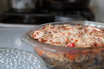 Dish with stewed tomatoes is cooked in the oven