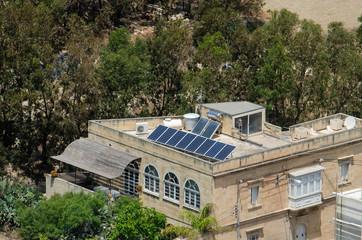 Fototapeta na wymiar Solar panels on roof house in Gozo, Malta.