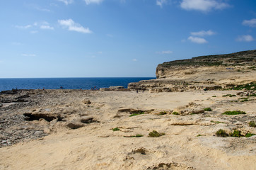 Fototapeta na wymiar Azure window in Malta. Place there Game of thrones was filming, famous location. Rocky coastline where Azure Window collapsed in Gozo Island, Dwejra, Malta.