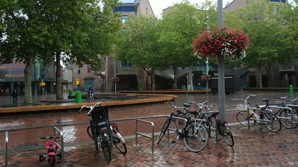 Amsterdam, Holland, August 2019. Urban outskirts of the city near the metro station Amsterdam Bijlmer Arena. Rainy day. Modern architecture. 25fps.
