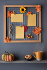 Photo grid board with Autumn leaves, tea cup and cookies on a shelf, copy-space