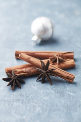 Star anise with cinnamon. Christmas spices on rustic wooden background. Copy space. 