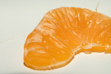 Closeup Photo of an Orange Slice on White Background