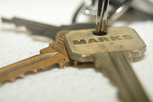 Close Up Photo of Apartment Keys on Keychain