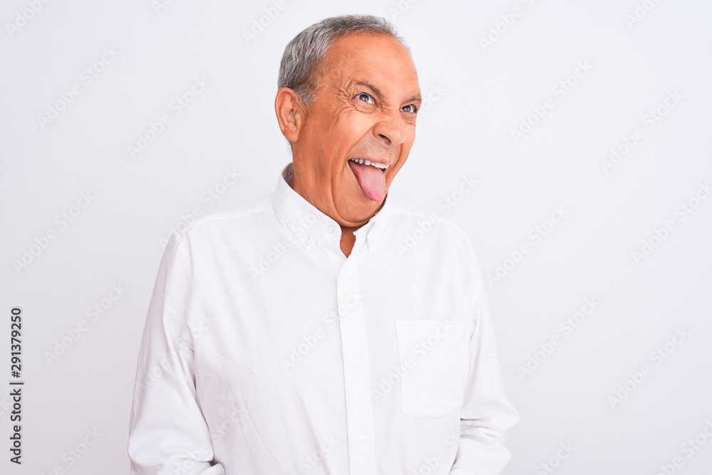 Poster senior grey-haired man wearing elegant shirt standing over isolated white background sticking tongue