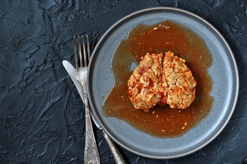 spooky halloween food. brains of a cow, sheep or calf in tomato sauce. dishes with offal. dish for Halloween. 