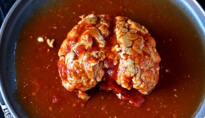 spooky halloween food. brains of a cow, sheep or calf in tomato sauce. dishes with offal. dish for Halloween. 