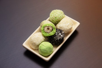 keto protein balls and matcha tea balls recipes on dark wooden background . it works ketogenic diet.
