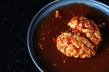spooky halloween food. brains of a cow, sheep or calf in tomato sauce. dishes with offal. dish for Halloween. 