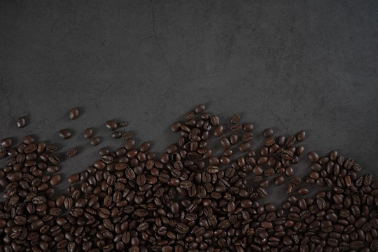 brown roasted coffee beans and coffee cup © LHG