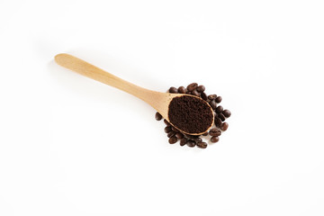 brown roasted coffee beans and coffee cup