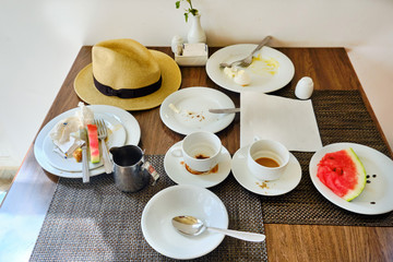Leftovers on the dining room table. Dirty cups and plates on the table, all inclusive