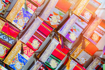 Obraz premium Bags traditional Arabic ornament hand of Fatima on the market in Medina, Tunisia