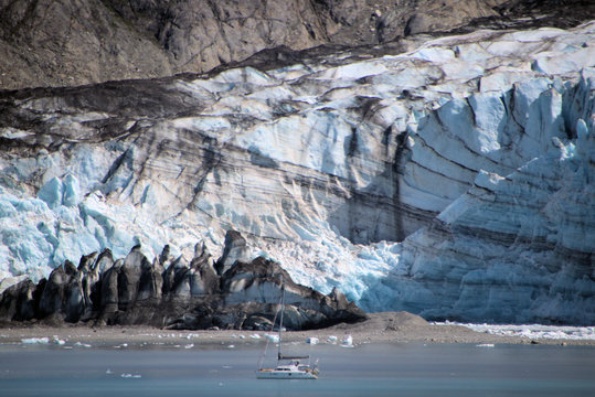 Sailboat Dwarfed by Glacier Head Wall Glacier Bay National Park USA