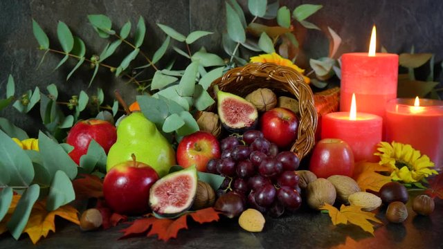 Thanksgiving cornucopia table setting centerpiece close up, dolly turning.