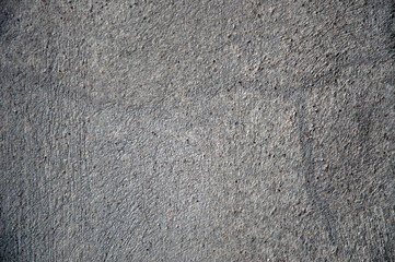 gray cracked lime stucco wall