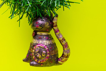 Vintage Ornament Christmas Decoration on bright yellow background. Winter Holidays concept.