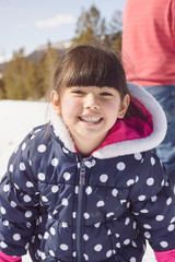 Portrait of a little girl in winter outfit in Wyoming, USA